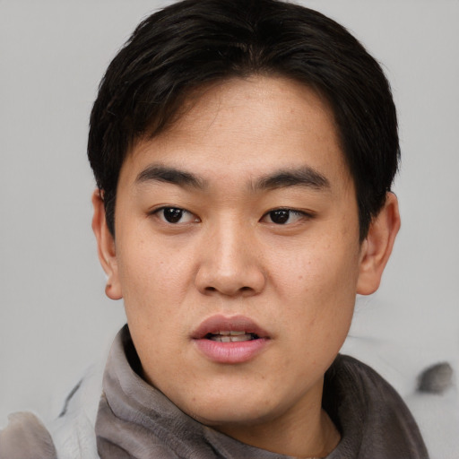 Neutral asian young-adult male with short  black hair and brown eyes