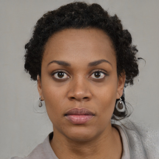 Neutral black young-adult female with short  black hair and brown eyes