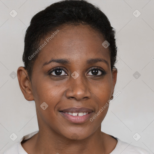 Joyful black young-adult female with short  brown hair and brown eyes