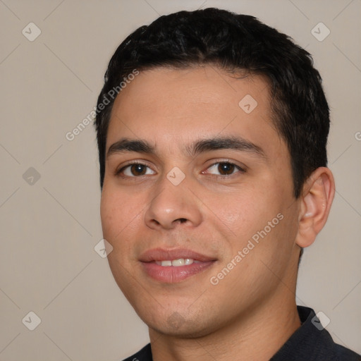 Joyful white young-adult male with short  black hair and brown eyes