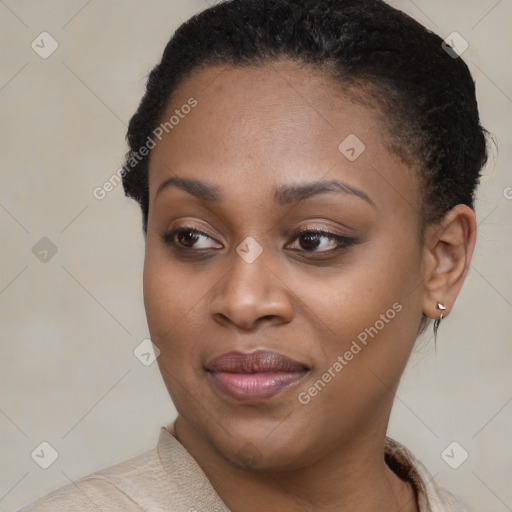 Joyful black young-adult female with short  brown hair and brown eyes