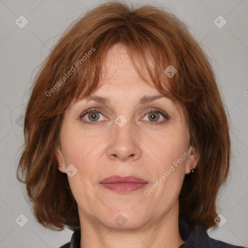 Joyful white adult female with medium  brown hair and grey eyes