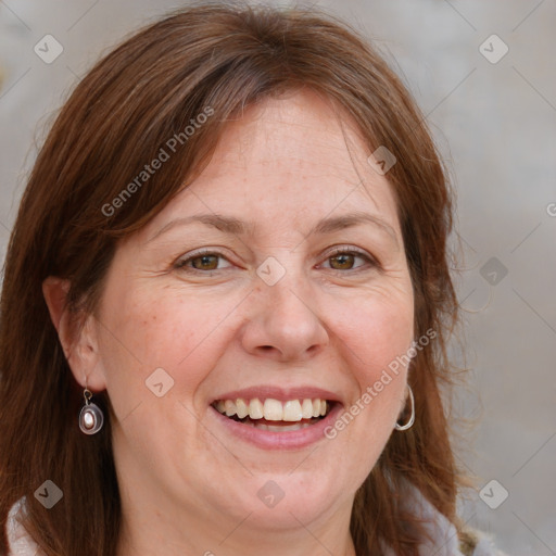 Joyful white adult female with medium  brown hair and grey eyes