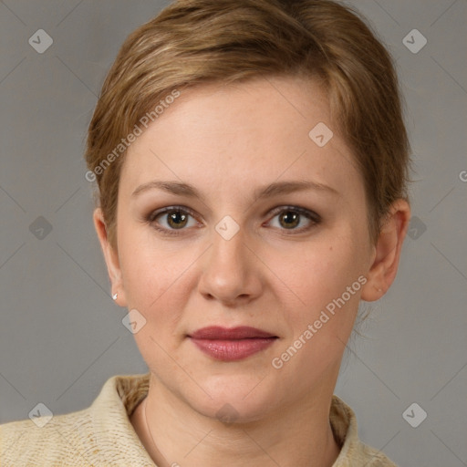 Joyful white young-adult female with short  brown hair and grey eyes