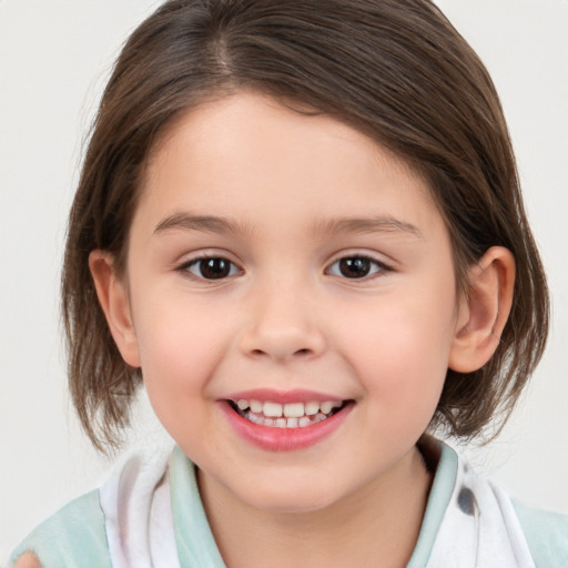 Joyful white child female with medium  brown hair and brown eyes