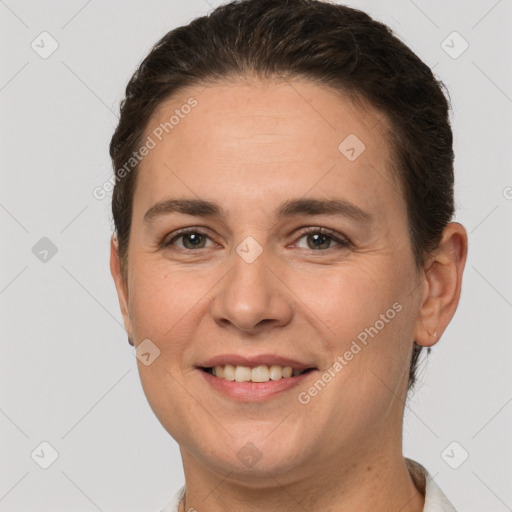 Joyful white young-adult female with short  brown hair and brown eyes