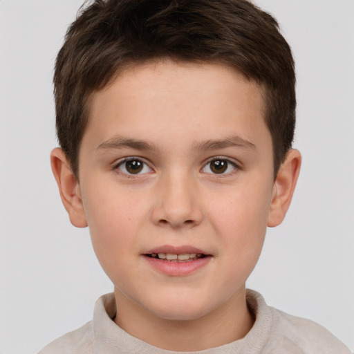 Joyful white child male with short  brown hair and brown eyes