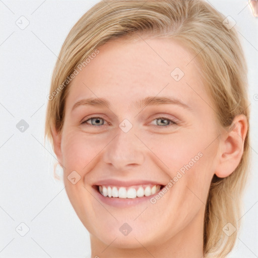 Joyful white young-adult female with medium  blond hair and blue eyes