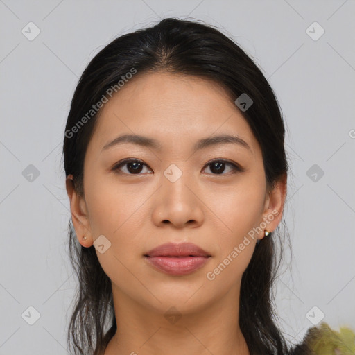 Joyful asian young-adult female with long  brown hair and brown eyes