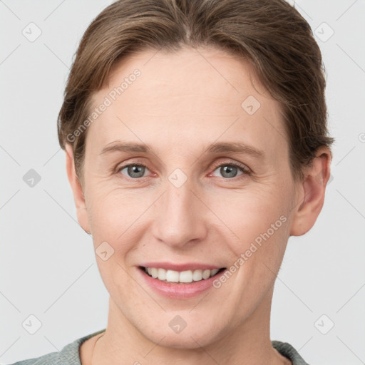 Joyful white young-adult female with short  brown hair and grey eyes