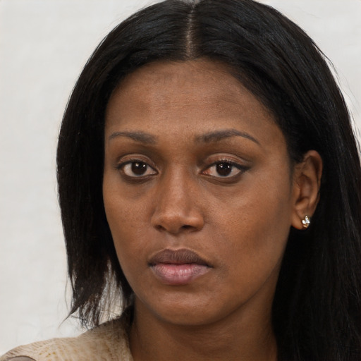 Neutral black young-adult female with long  black hair and brown eyes