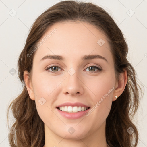 Joyful white young-adult female with medium  brown hair and green eyes