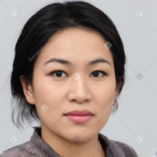 Joyful asian young-adult female with medium  black hair and brown eyes