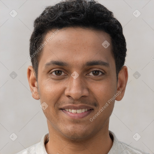 Joyful latino young-adult male with short  brown hair and brown eyes