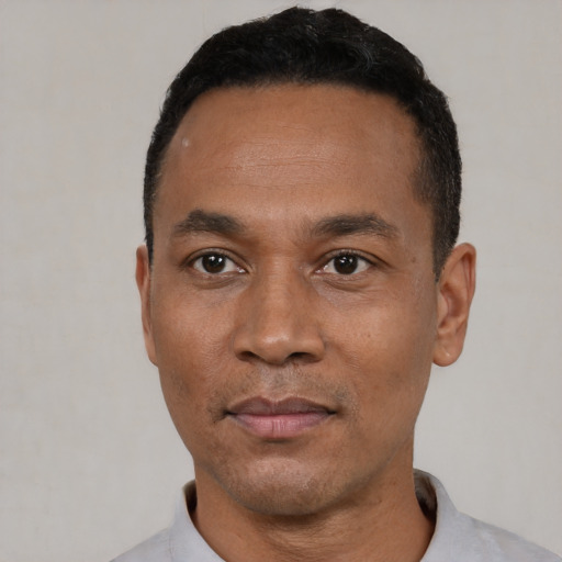 Neutral black adult male with short  black hair and brown eyes