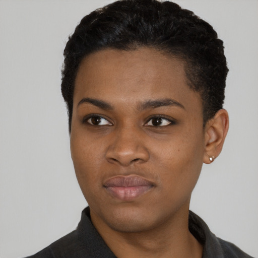Joyful black young-adult female with short  black hair and brown eyes