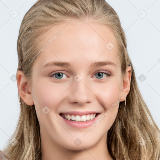 Joyful white young-adult female with long  brown hair and blue eyes