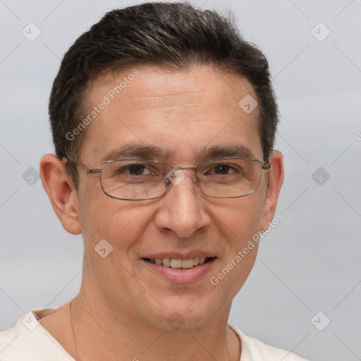 Joyful white adult male with short  brown hair and brown eyes