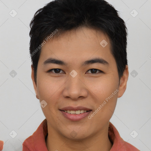 Joyful asian young-adult male with short  brown hair and brown eyes