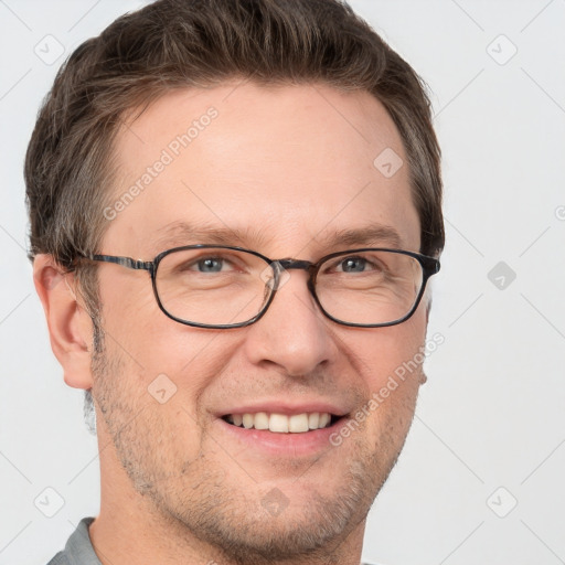 Joyful white adult male with short  brown hair and grey eyes