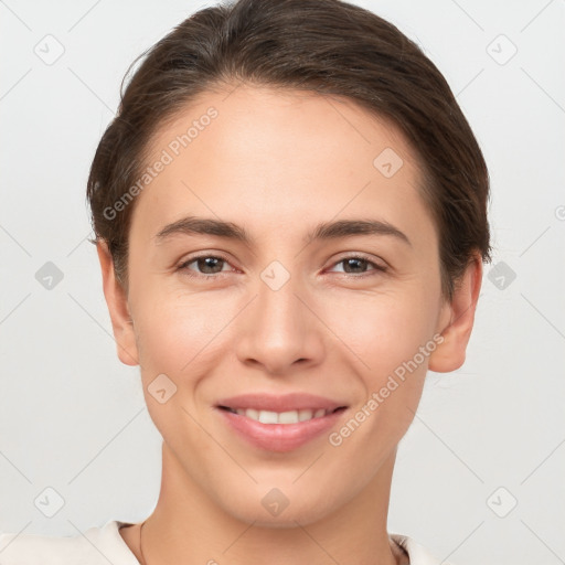 Joyful white young-adult female with short  brown hair and brown eyes