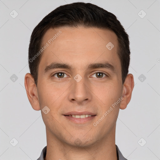 Joyful white young-adult male with short  brown hair and brown eyes