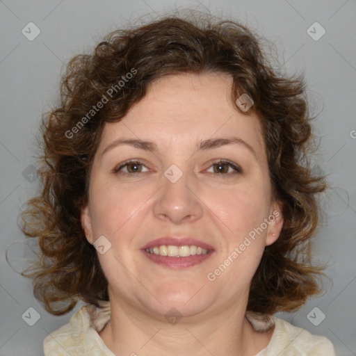 Joyful white adult female with medium  brown hair and blue eyes