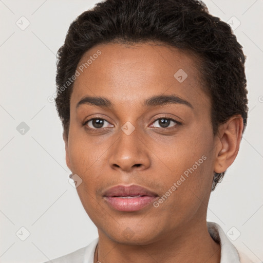 Joyful black young-adult female with short  brown hair and brown eyes