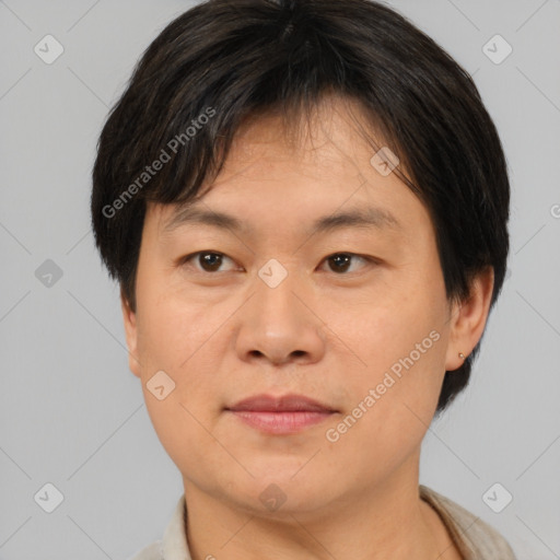 Joyful asian young-adult male with short  brown hair and brown eyes