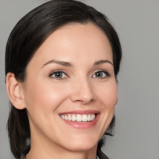 Joyful white young-adult female with medium  brown hair and brown eyes