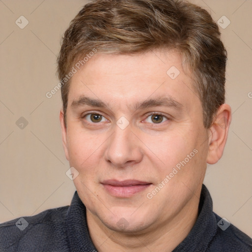 Joyful white adult male with short  brown hair and brown eyes