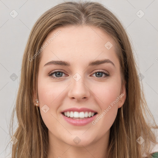 Joyful white young-adult female with long  brown hair and green eyes