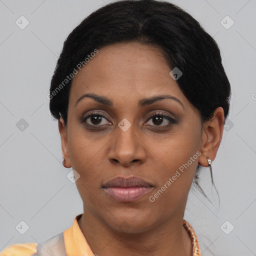 Joyful black young-adult female with short  brown hair and brown eyes