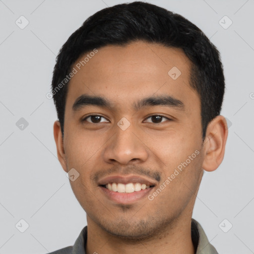 Joyful latino young-adult male with short  black hair and brown eyes