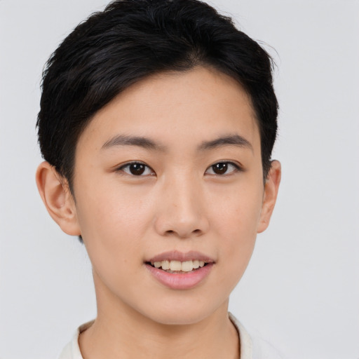 Joyful asian young-adult female with short  brown hair and brown eyes