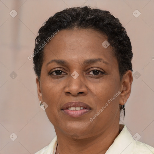 Joyful latino adult female with short  brown hair and brown eyes