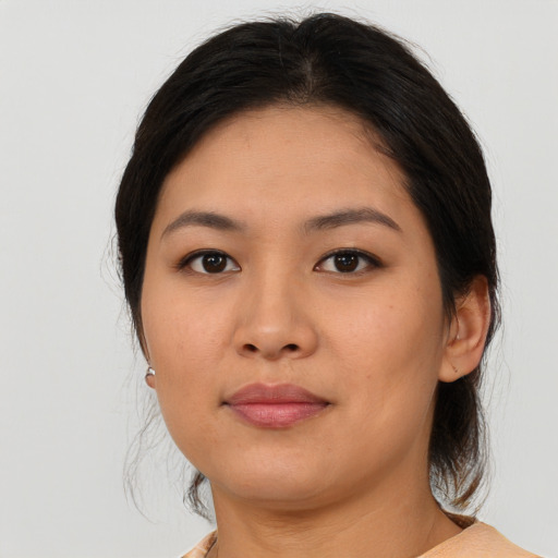 Neutral asian young-adult female with medium  brown hair and brown eyes