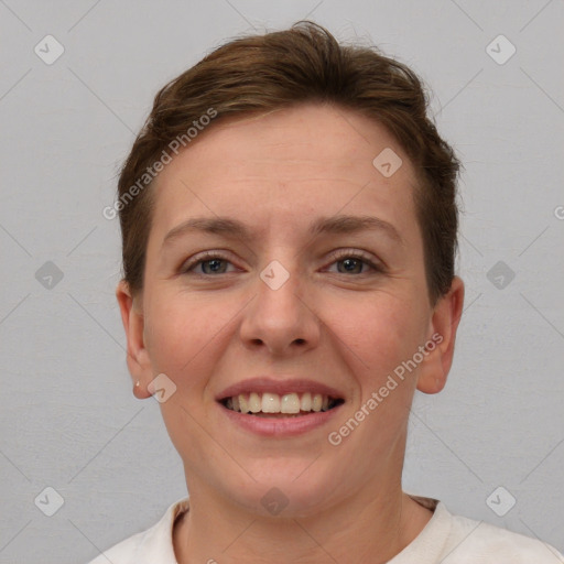 Joyful white young-adult female with short  brown hair and grey eyes