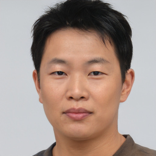 Neutral asian young-adult male with short  black hair and brown eyes