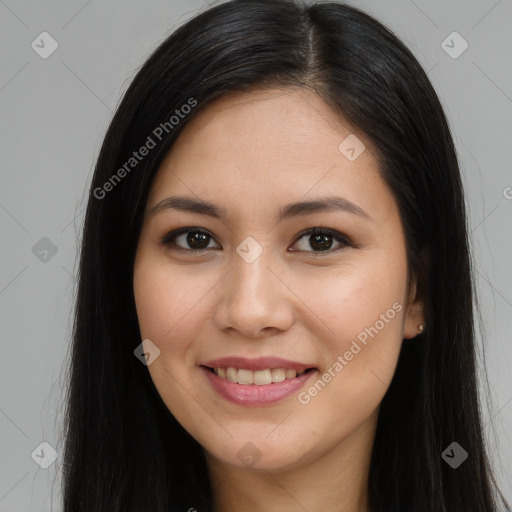 Joyful asian young-adult female with long  brown hair and brown eyes