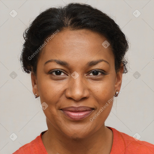 Joyful black adult female with short  brown hair and brown eyes