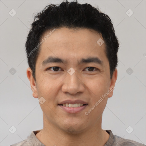 Joyful latino young-adult male with short  black hair and brown eyes