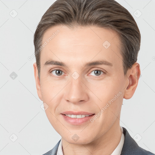 Joyful white adult male with short  brown hair and brown eyes