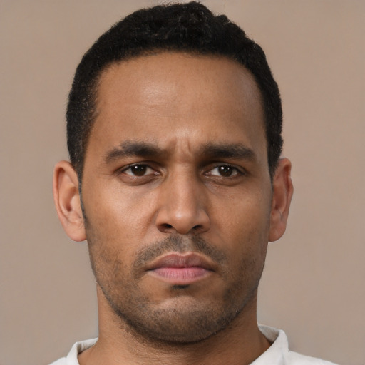 Neutral black young-adult male with short  black hair and brown eyes