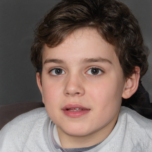 Joyful white child female with short  brown hair and blue eyes