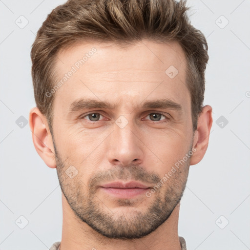 Joyful white young-adult male with short  brown hair and grey eyes