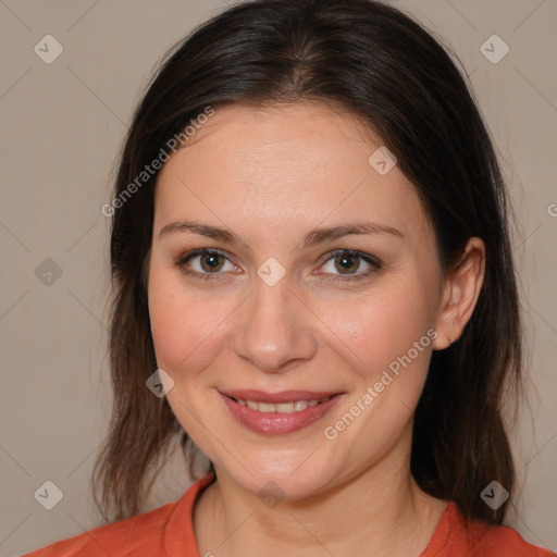 Joyful white adult female with medium  brown hair and brown eyes