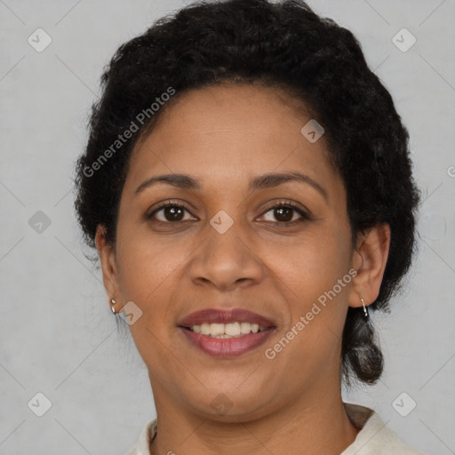 Joyful latino adult female with short  brown hair and brown eyes