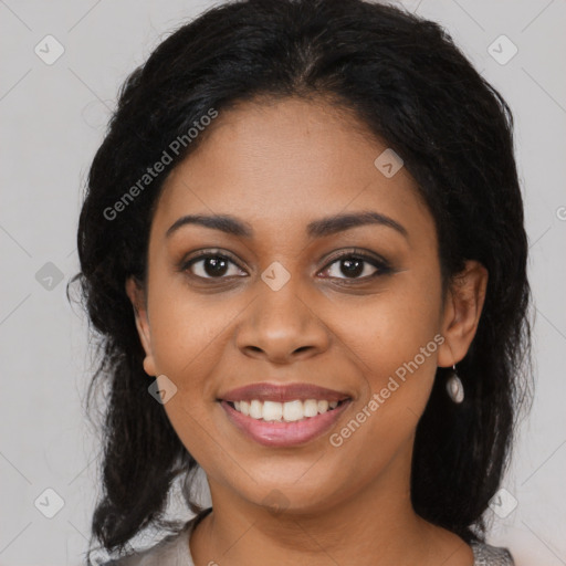 Joyful black young-adult female with medium  black hair and brown eyes