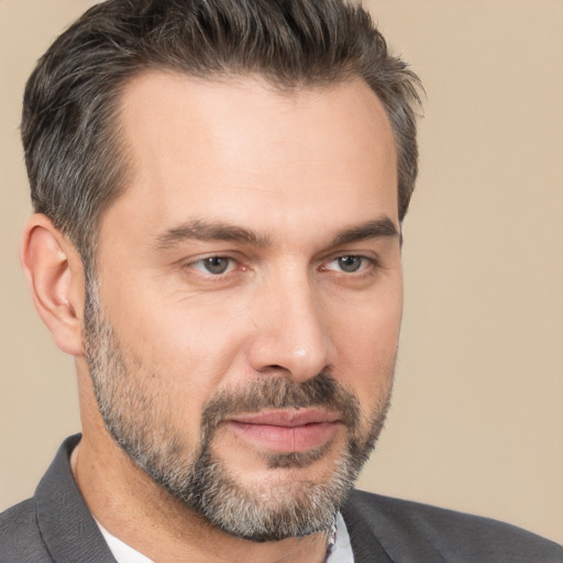 Joyful white adult male with short  brown hair and brown eyes